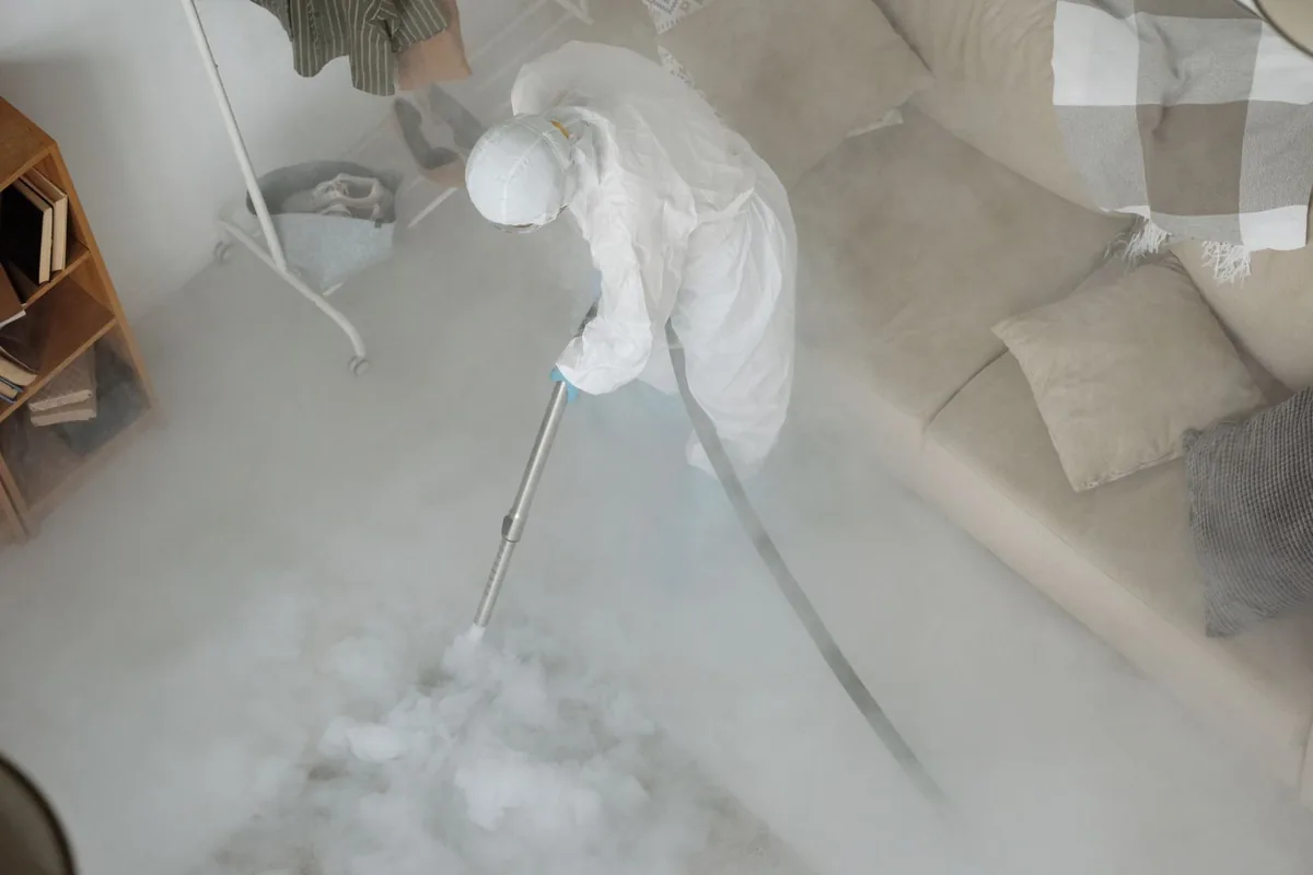 Biohazard cleanup technician in protective equipment, Worcester, MA
